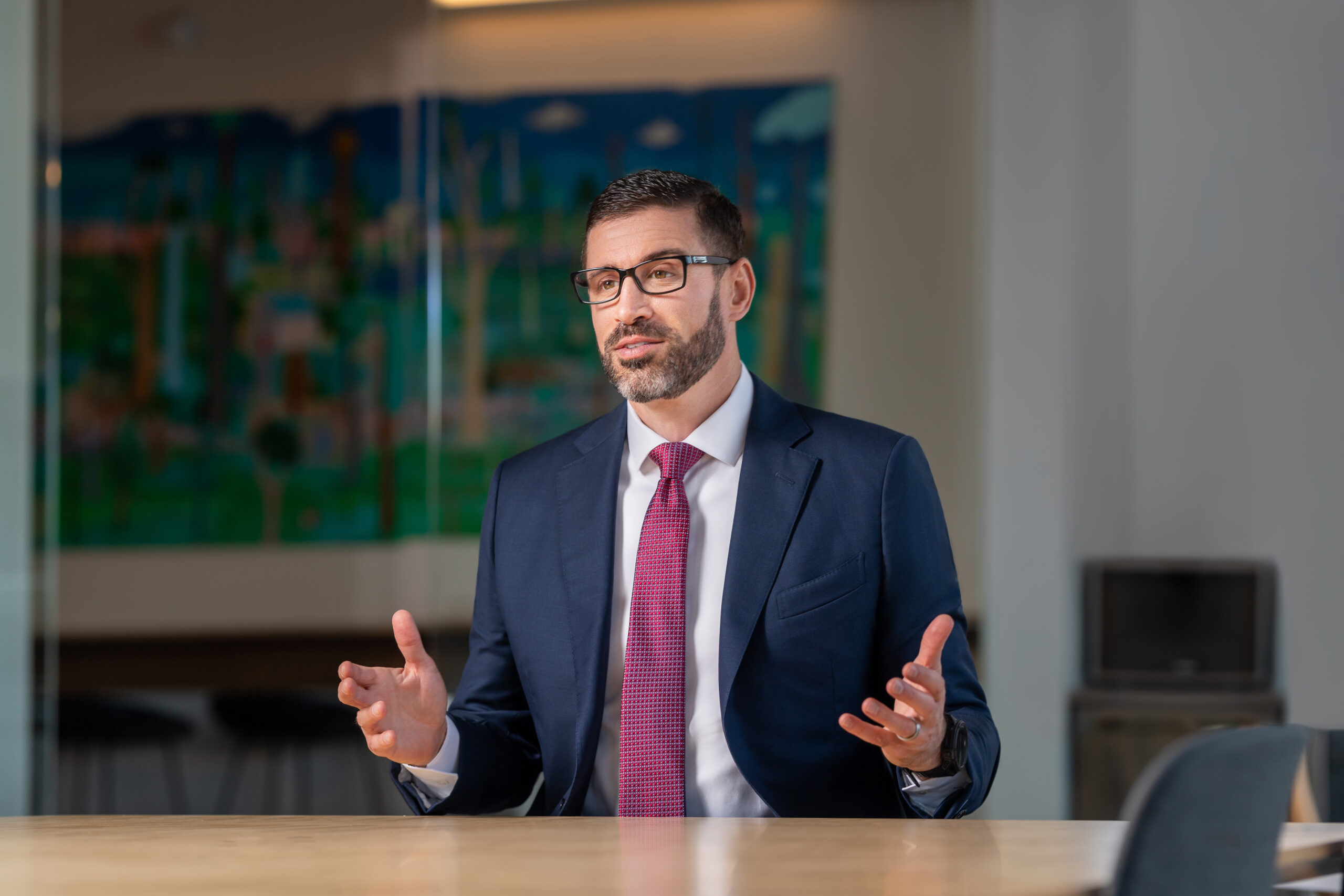 A man in a suit and tie embodying office culture.